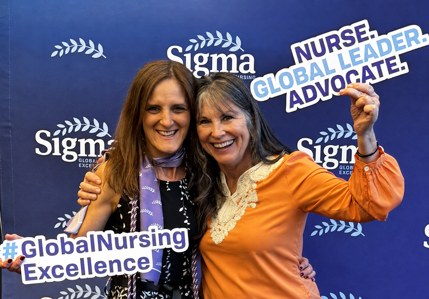 Dr. Judi Allyn Godsey (US) and Dr. Hildegart Gonzalez Luis (Spain) celebrating global nursing scholarship and leadership during a Sigma conference.