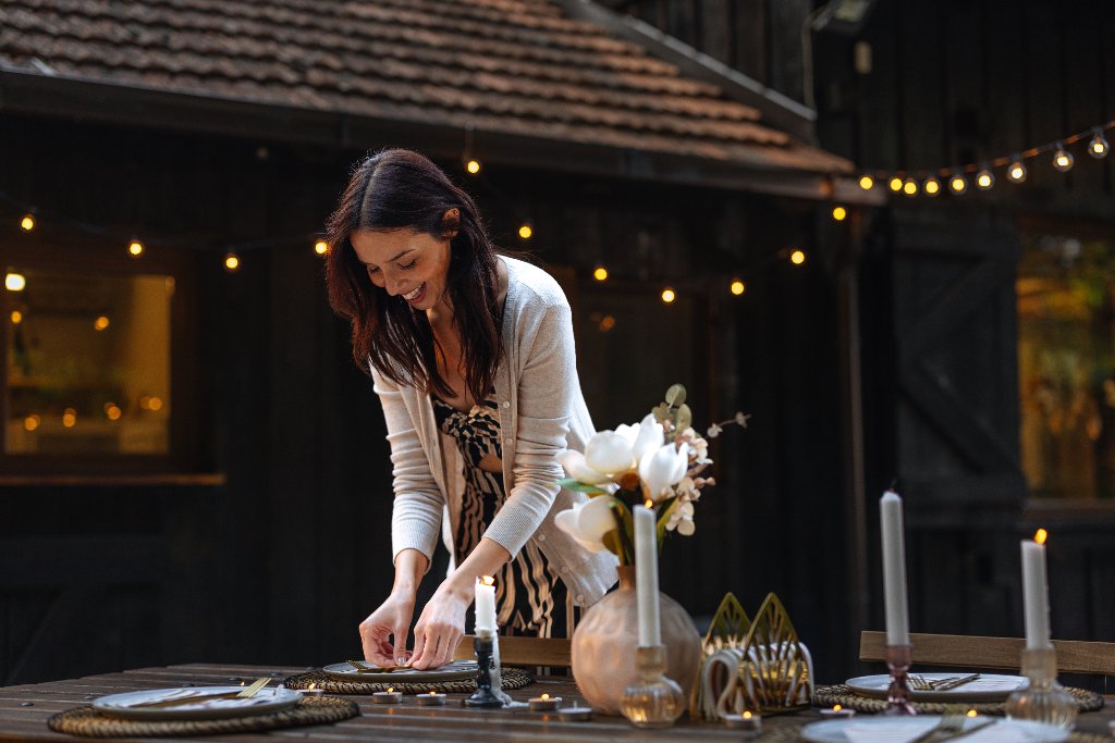 A beautifully set outdoor table as golden light fades