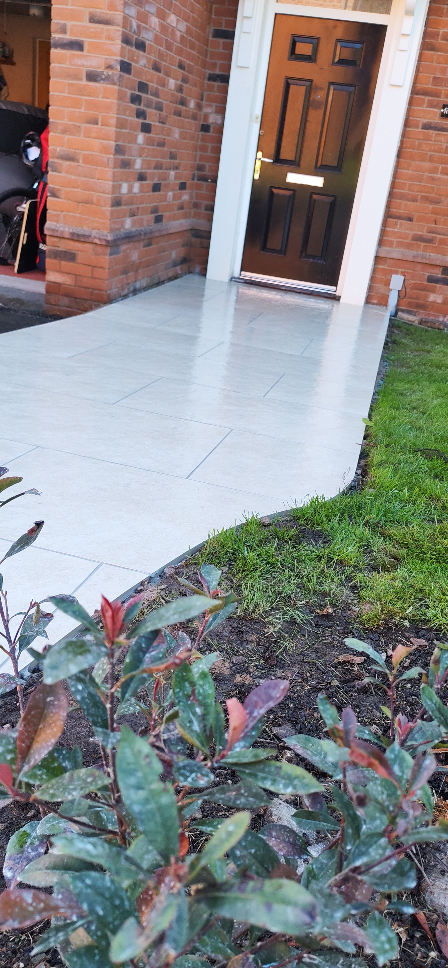 After: Porcelain Patio Walkway in Shropshire — completed garden transformation by Shropshire Landscaping & Design, serving Shrewsbury, Telford & Oswestry