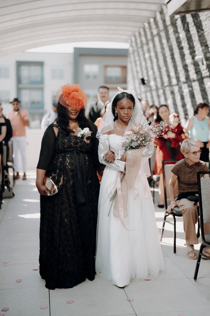 Tionge walking down the aisle