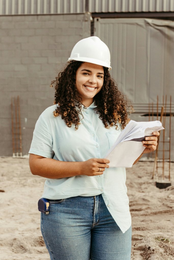 Engineer holding drawings on a jobsite
