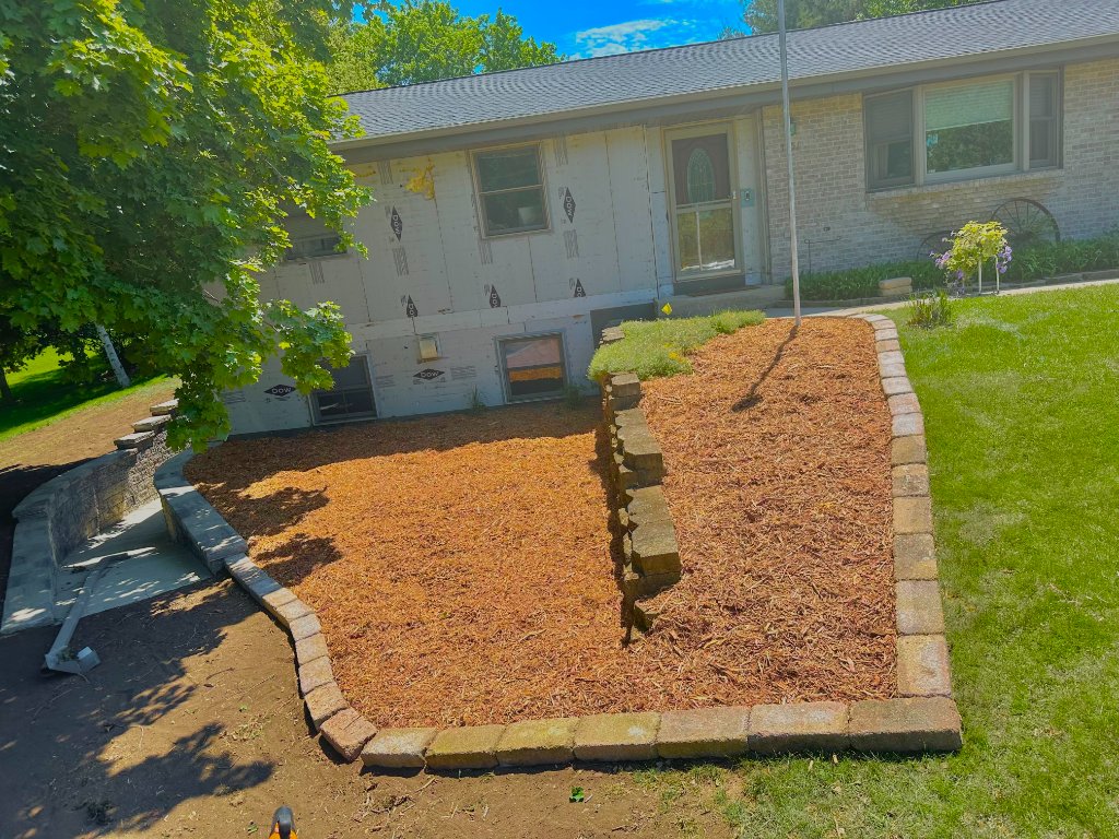 Rock and plant flower bed edging