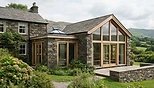 Roofing craftsmanship on a stone home