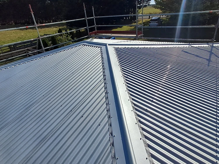 Long-run re-roofing installation by Roof-It Robbie