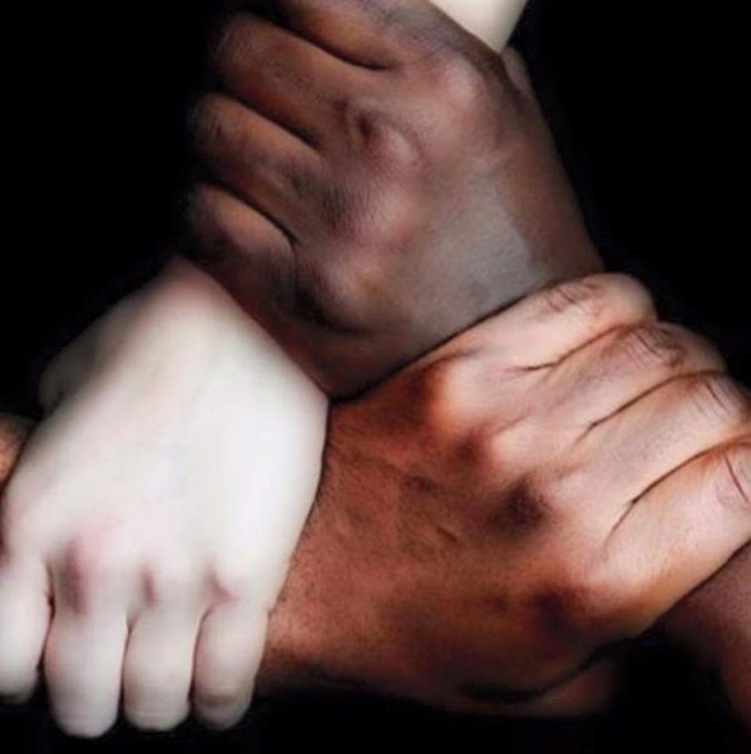Unity — diverse hands joined together in community