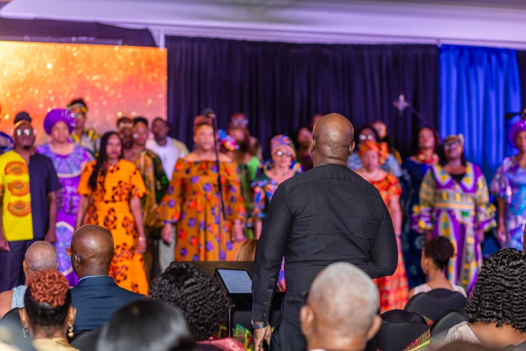Mentors performing with ensemble on stage