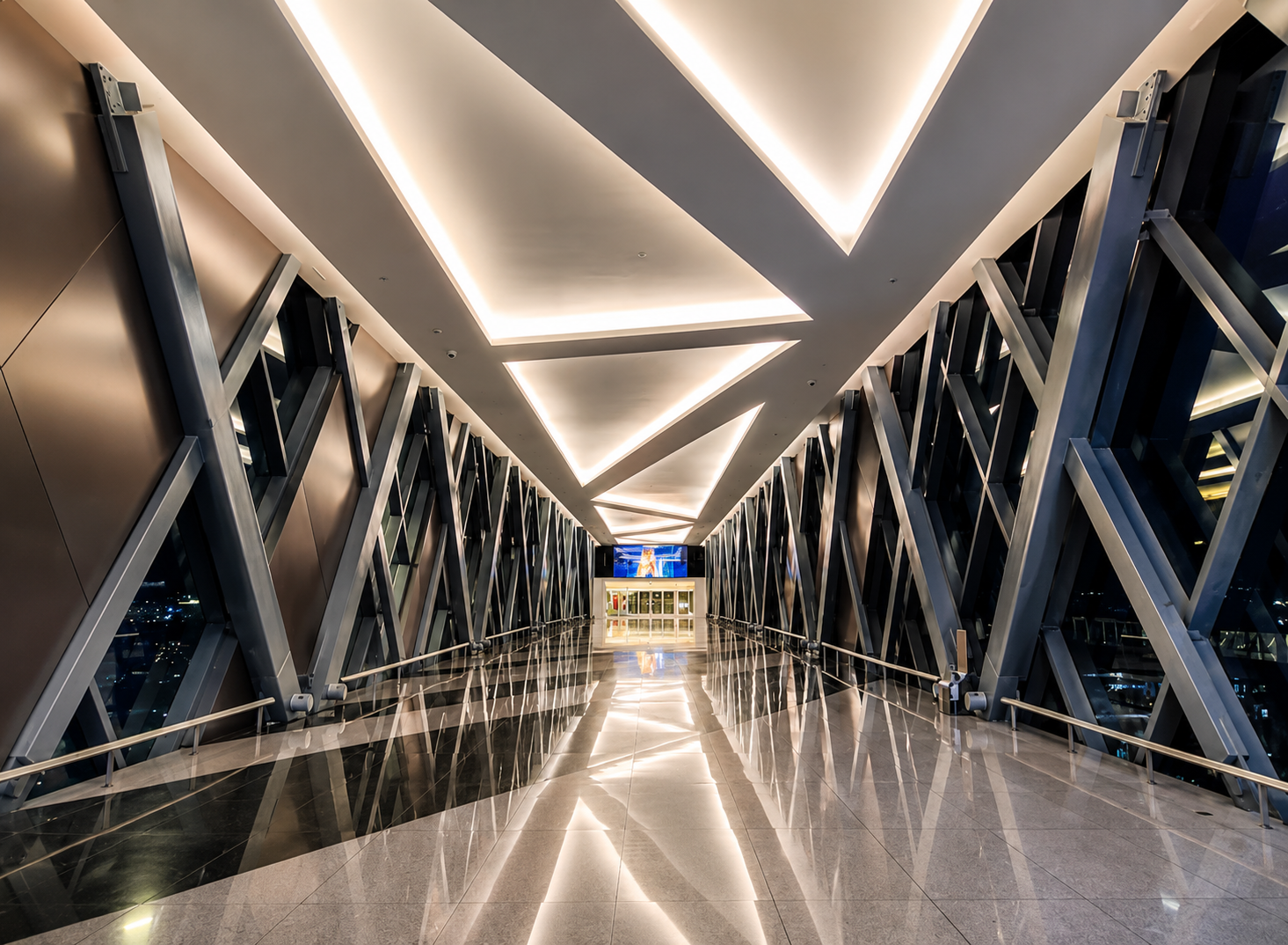 Modern airport transit corridor with geometric truss ceiling inside NAIA