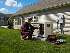 A&A GenPro technician performing annual maintenance on a home standby generator