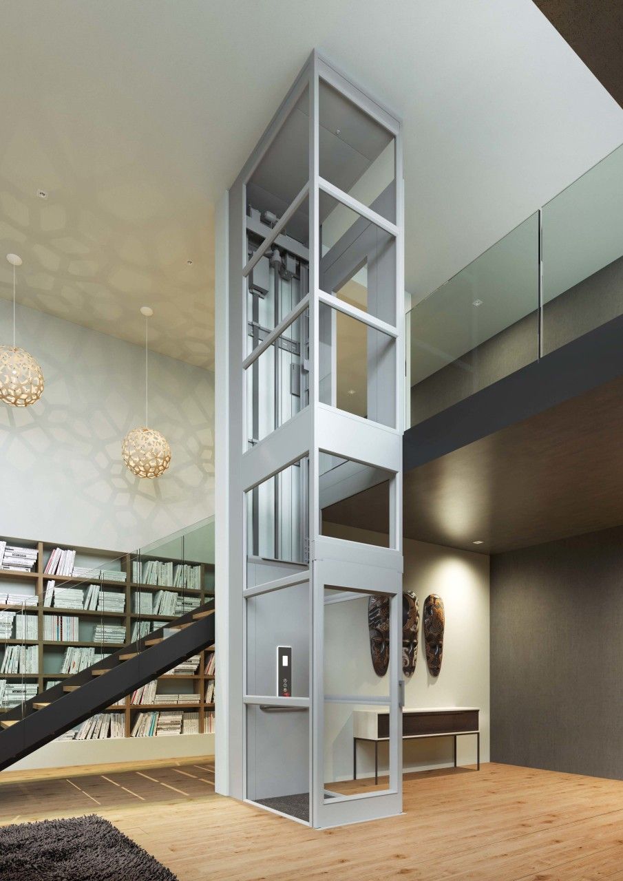 Lift — elevador de cristal en interior residencial
