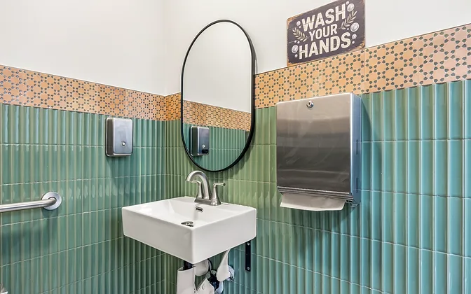 Mariscos El Güero — bar counter with tile and gold stools — hospitality interior design in San Bernardino, CA by Studio Fridae