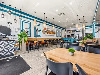 Mariscos El Güero dining room looking toward the service counter — hospitality interior design in San Bernardino, CA by Studio Fridae