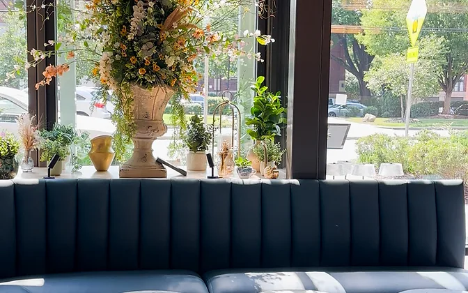 Flora — moody teal booth seating in a compact restaurant footprint — hospitality interior design in Charlotte, NC by Studio Fridae