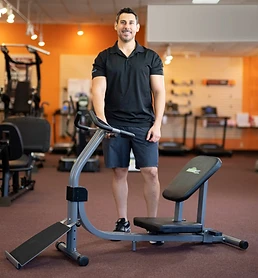Jonathan Hyams, founder of Nitrofit, standing behind the Limber Pro stretch machine