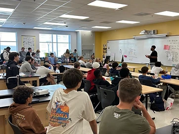 Elijah Green speaking to a classroom of high school students about mental health
