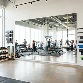 Wall-to-wall gym mirror installation