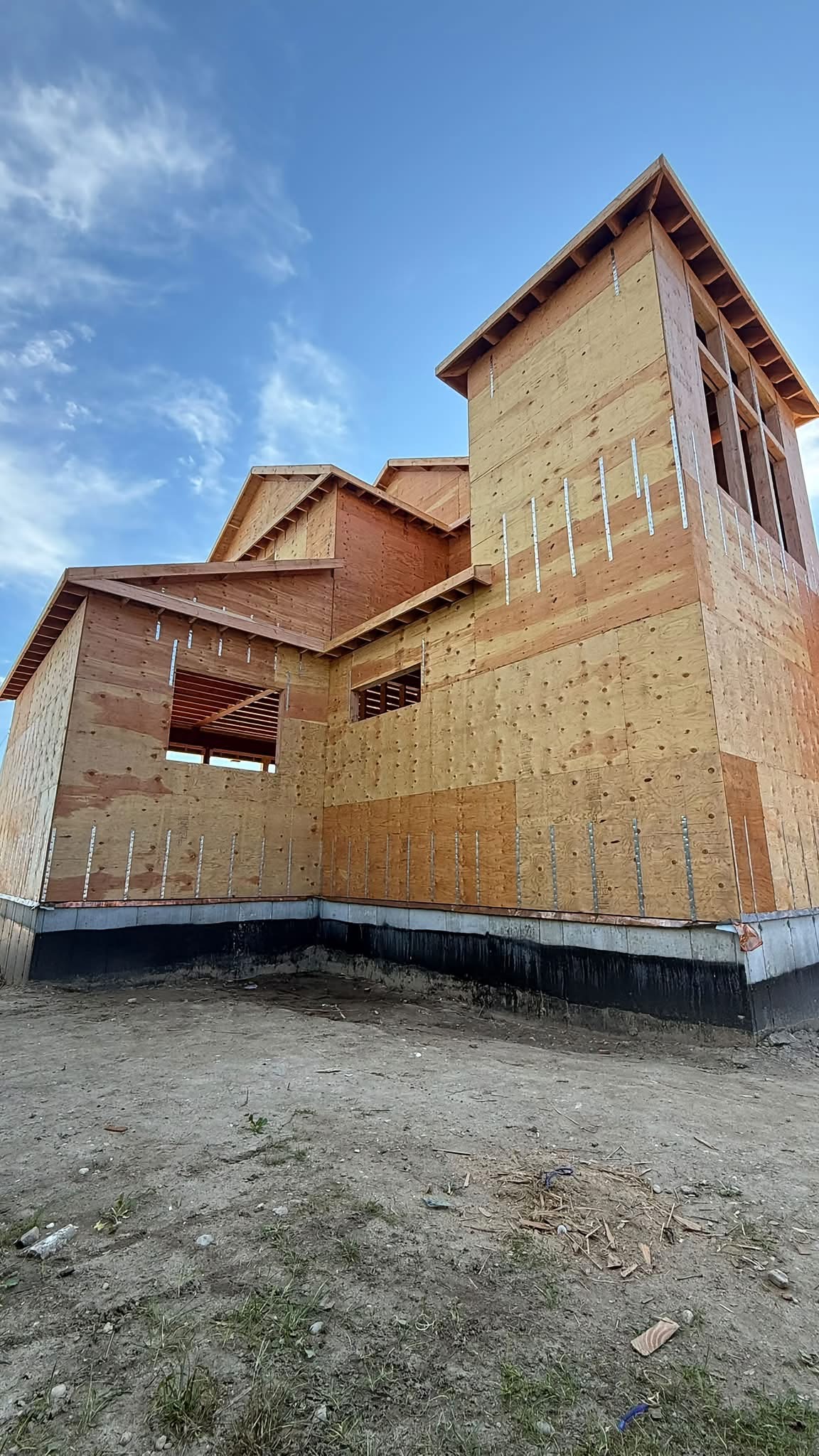 ADU exterior with plywood sheathing and metal hurricane ties