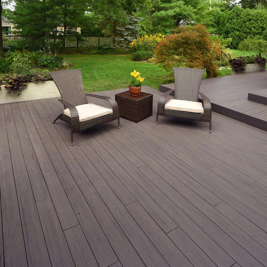 Deck with wicker seating and yellow flowers