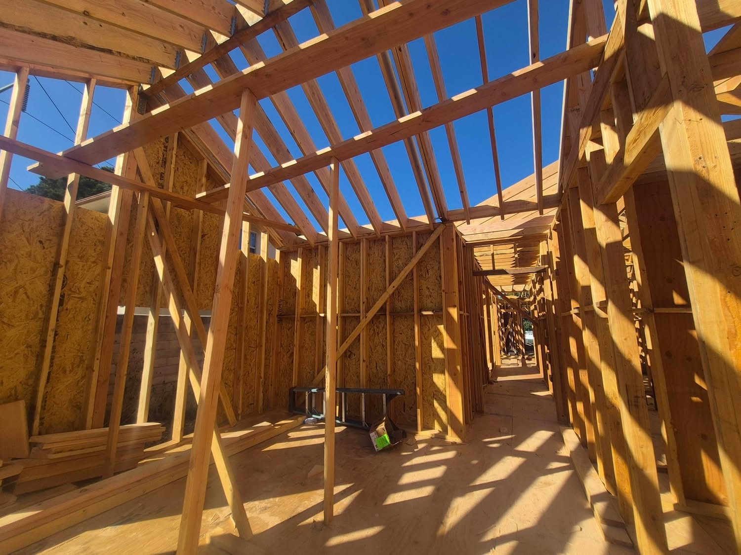 Interior framing of ADU with roof rafters open to the sky