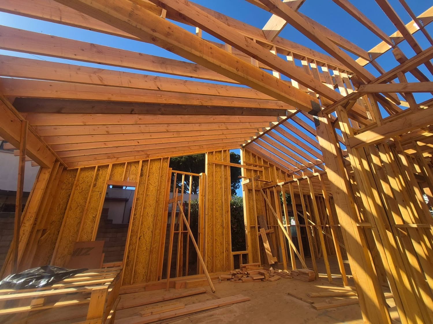 Interior view of ADU roof rafters and trusses under construction