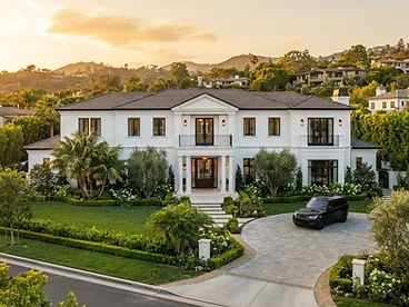 Large Beverly Hills luxury home with freshly painted white stucco exterior