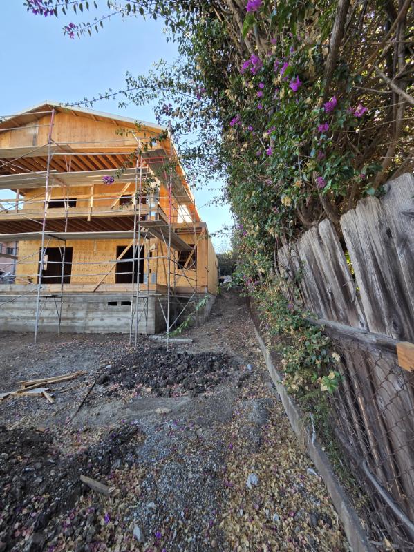 Side View With Scaffolding and Bougainvillea
