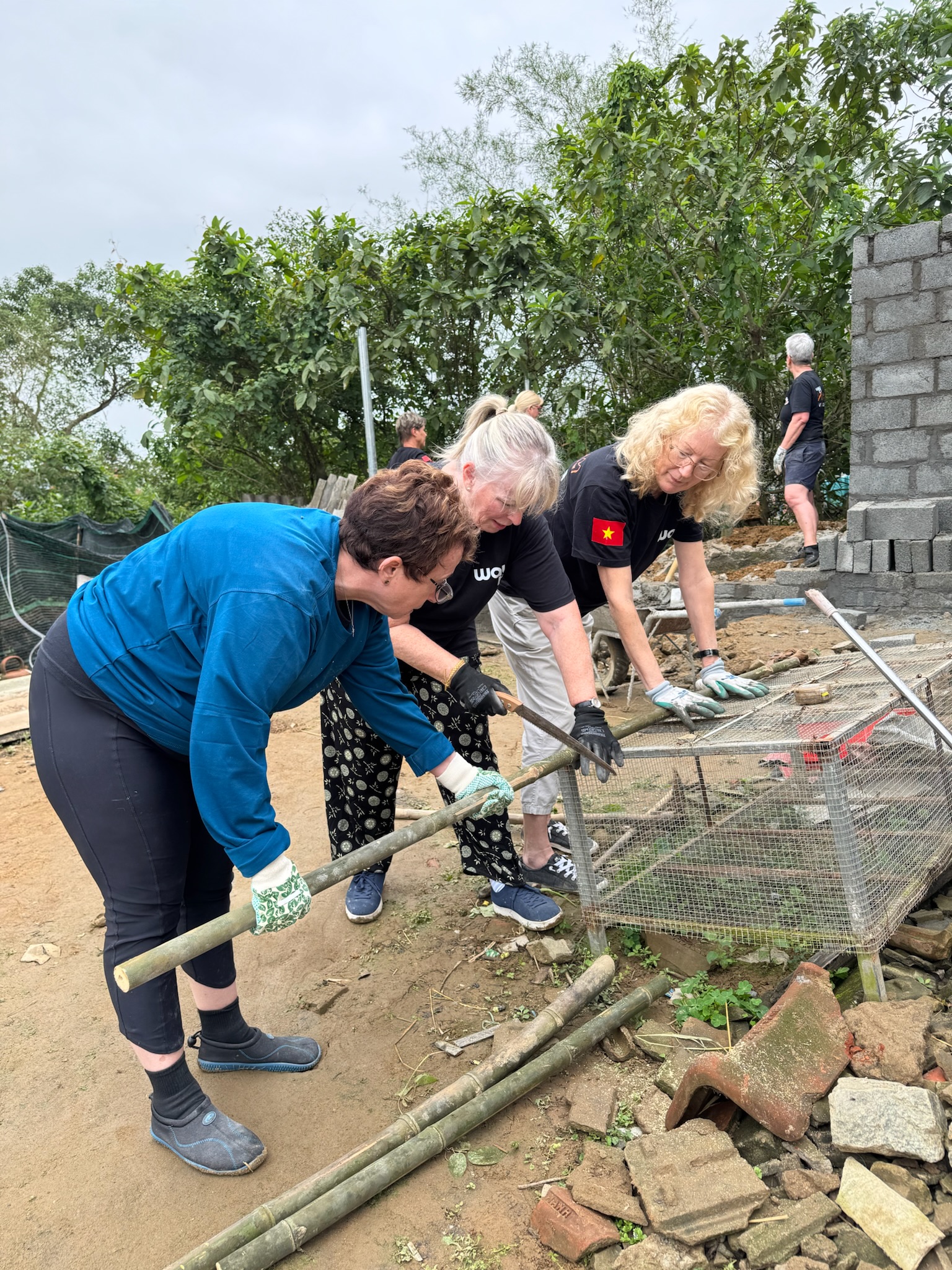 Volunteers working together on the project frame