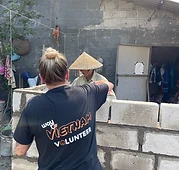 Laying a cinder block on the wall