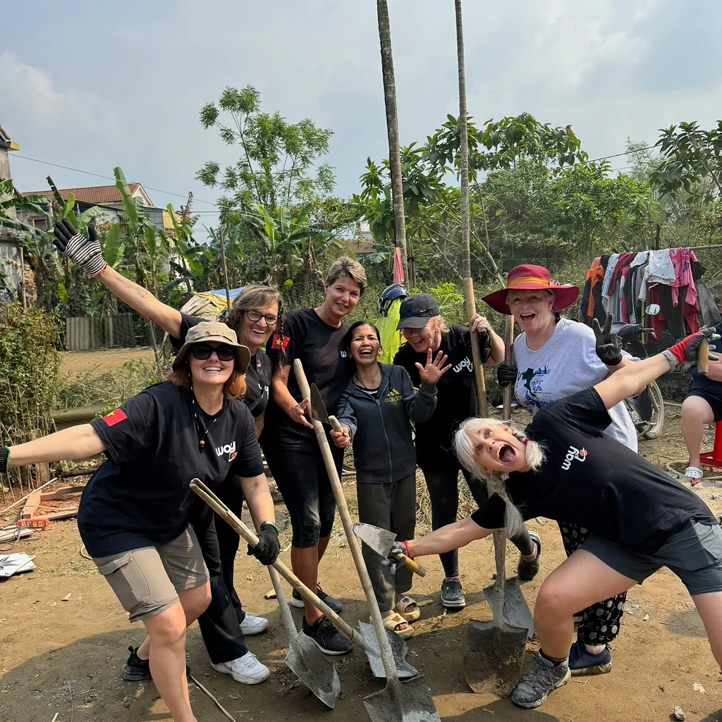 Volunteers posing with shovels