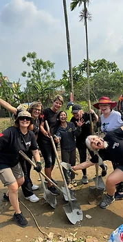 Volunteers posing with shovels