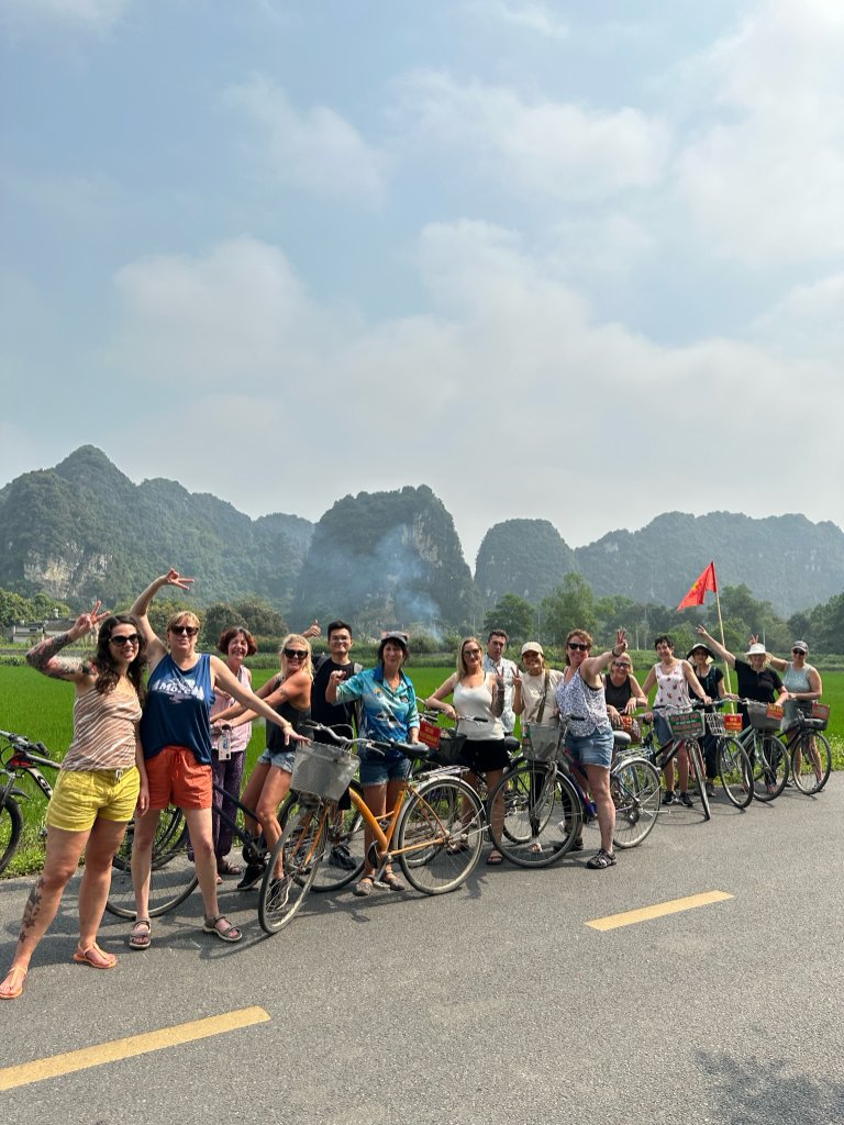 Way To Travel group rafting through a Vietnamese lake surrounded by mountains