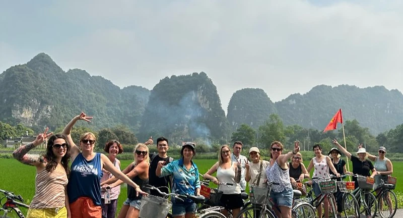 Way To Travel group of travellers rafting together on a lake surrounded by mountains