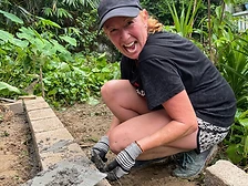 A smiling Way To Travel volunteer at the build site