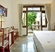 Comfortable queen bedroom with balcony at Hoi An TNT Villa