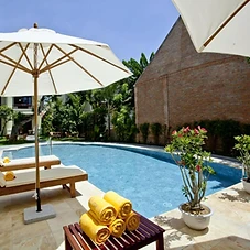 Swimming pool with sun loungers at Hoi An TNT Villa