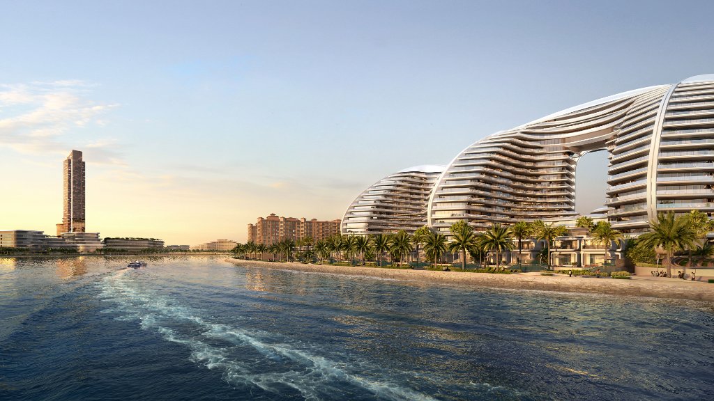 Oystra development at golden hour with yacht and coastal view toward Wynn casino tower