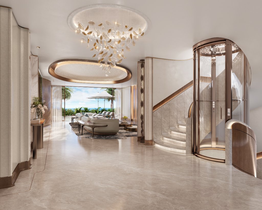 Oystra Villa Entrance Hall with Glass Elevator Oystra villa entrance hall with circular glass elevator and sculptural staircase by HBA