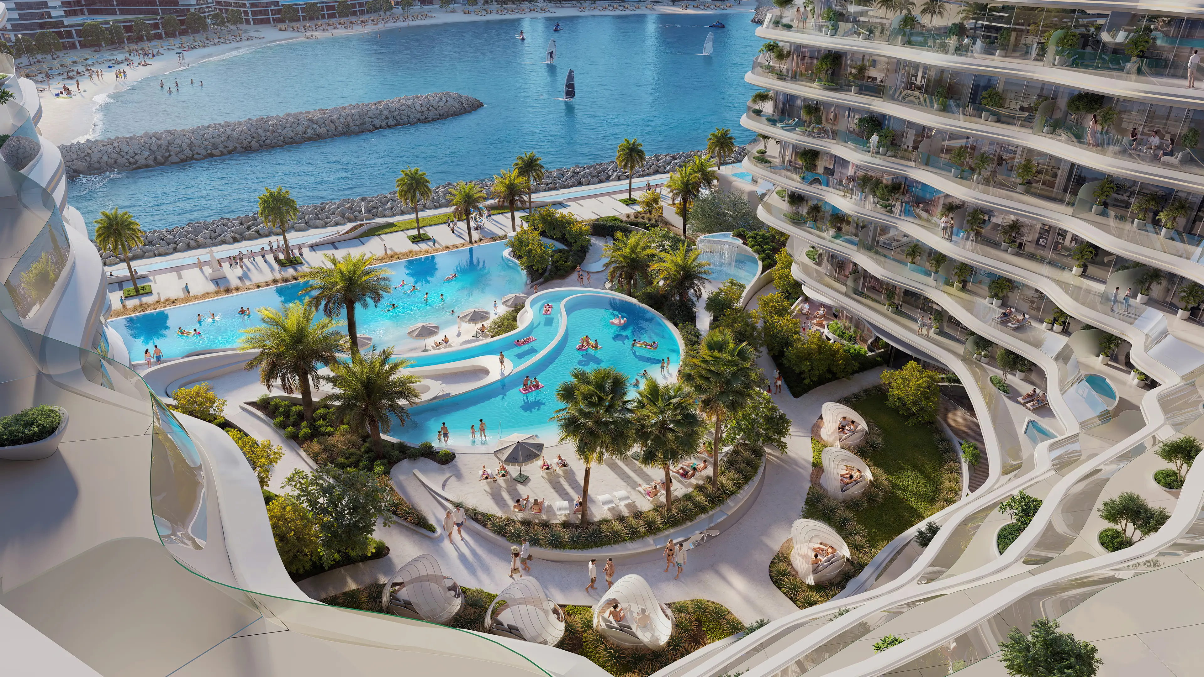 Oystra Beach Club Courtyard Aerial Oystra beach club courtyard with dual-section resort pool and shell-shaped cabanas viewed from above