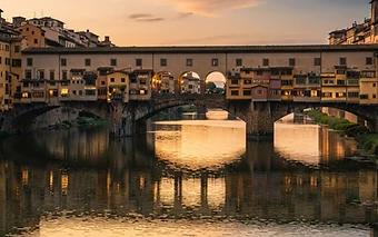 A wide cinematic view of Ponte Vecchio