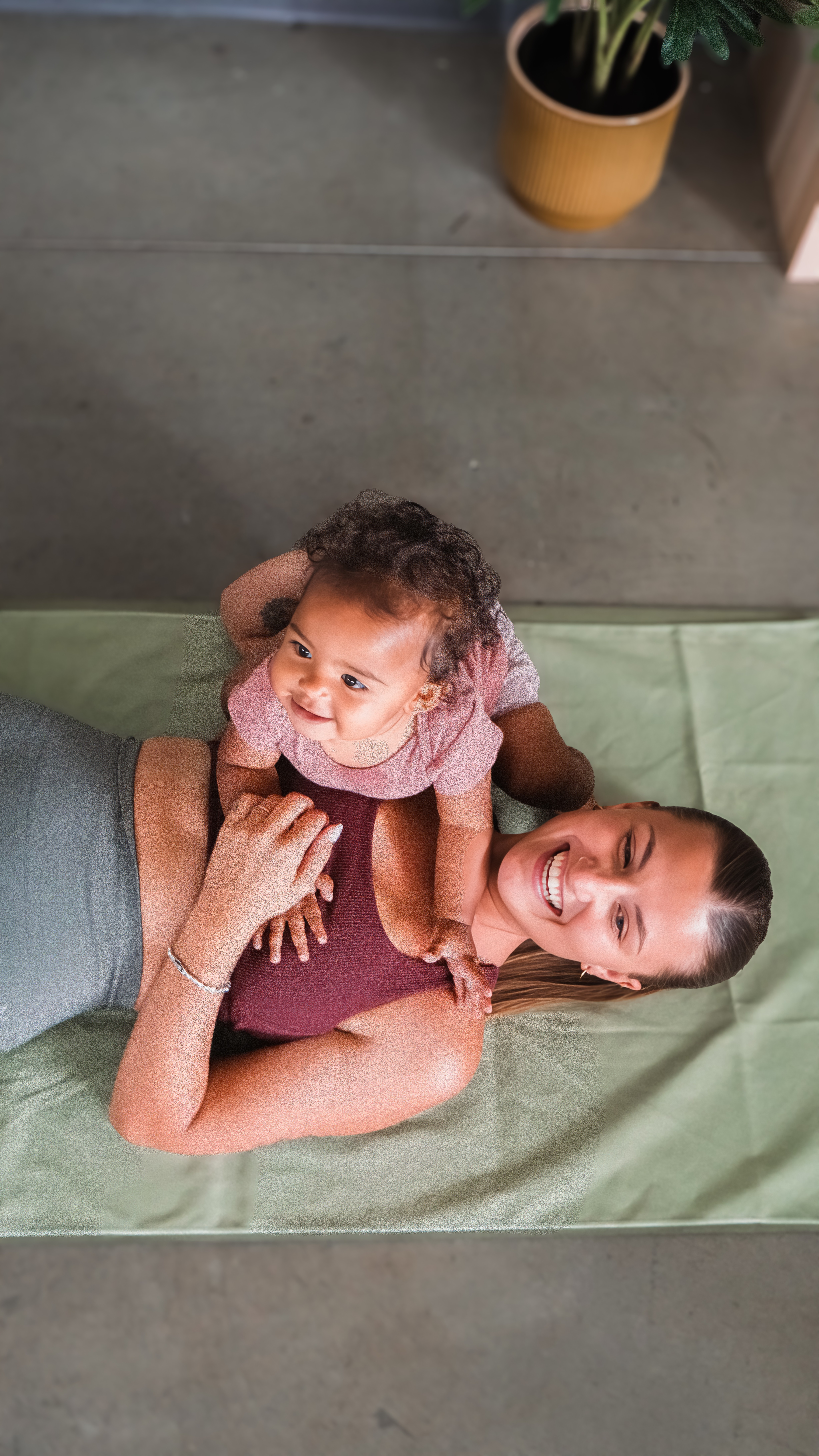 Mom and baby doing Pilates