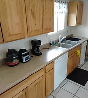 Kitchen counter, coffee maker and dishwasher