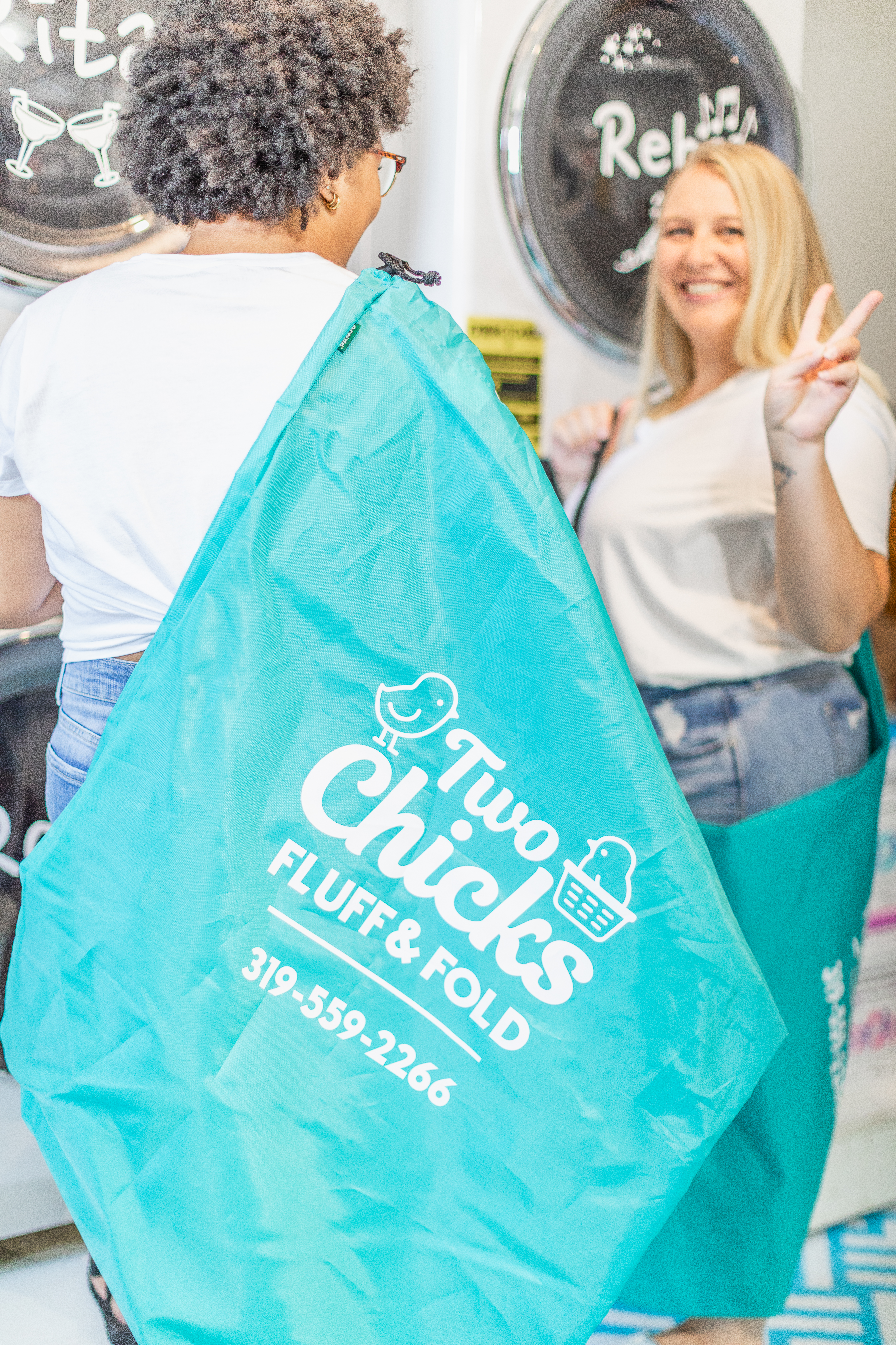 A Two Chicks team member holding the real teal Bubble Bag