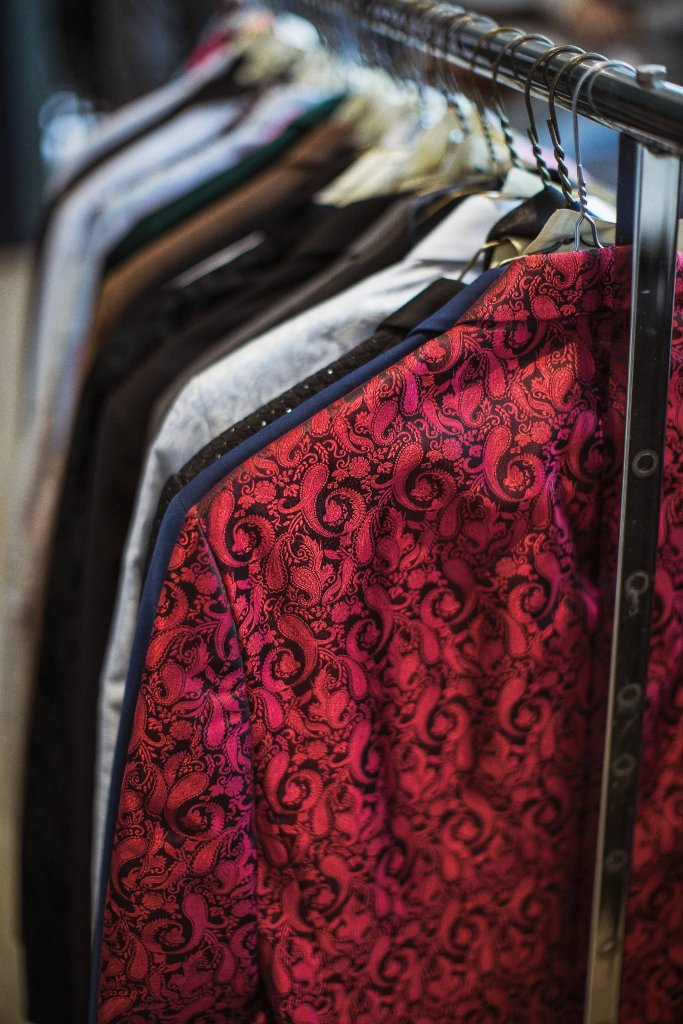 Tuxedos hanging on a rack