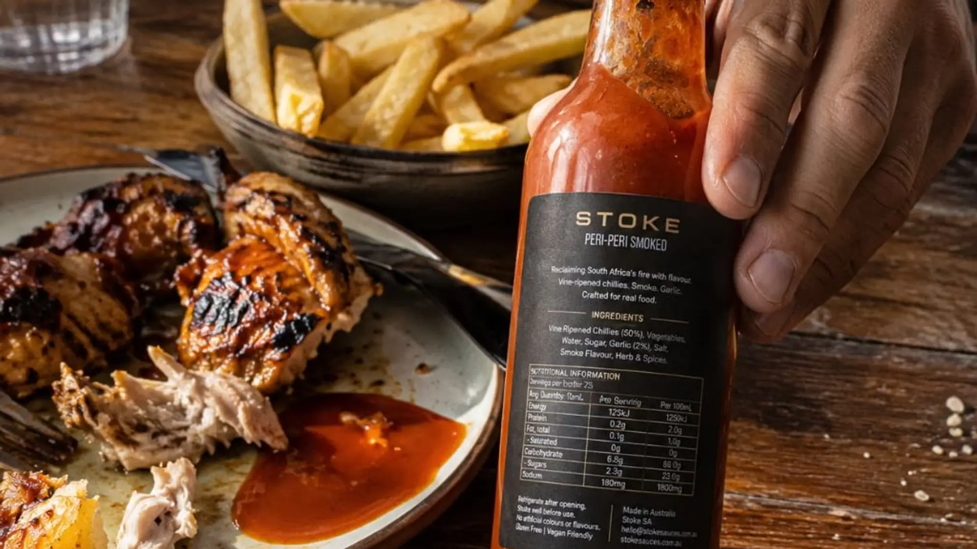 Close-up of STOKE peri-peri sauce bottle