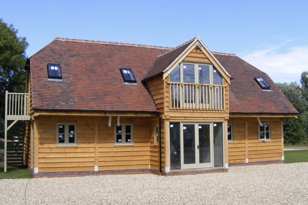 Four-bay lofted oak framed garage with upper-floor rooflights