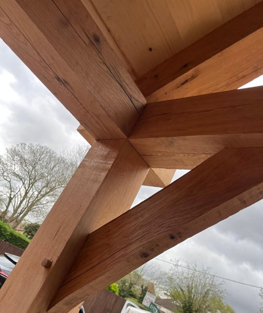Hand-cut oak joint with traditional pegged joinery