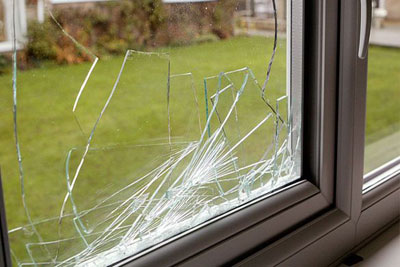Shattered glass pane in a uPVC window frame