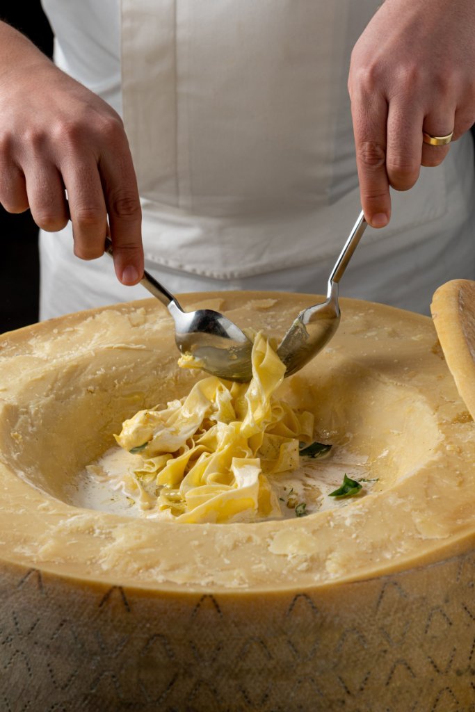 Pasta tossed in cheese wheel