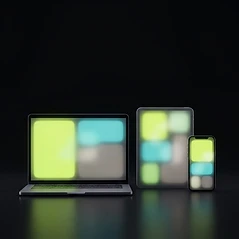 Illustration stylisée d’un ordinateur, d’une tablette et d’un téléphone posés sur une surface sombre, leurs écrans montrant des blocs de couleur abstraits sans texte