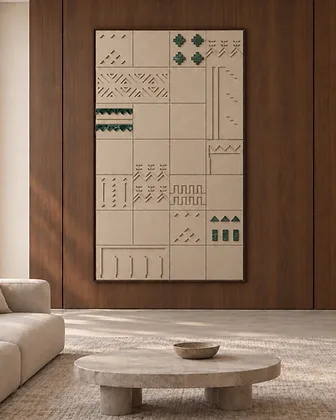 Interior feature wall of textured stone tiles with a linear fireplace and brushed brass backing in a modern living room