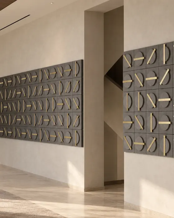 Dial Basalt Tile Wall, Black basalt with brass inlay, Textured stone discs with polished brass bars finish